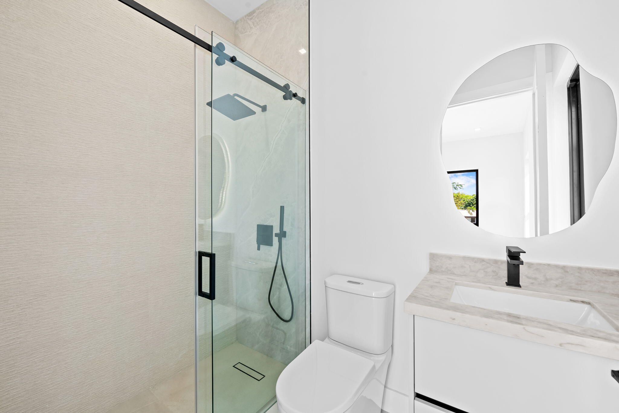 2324 Southwest 26th Street Miami, FL 33133 - Photo 14 of 45 a bathroom with a toilet sink and shower
