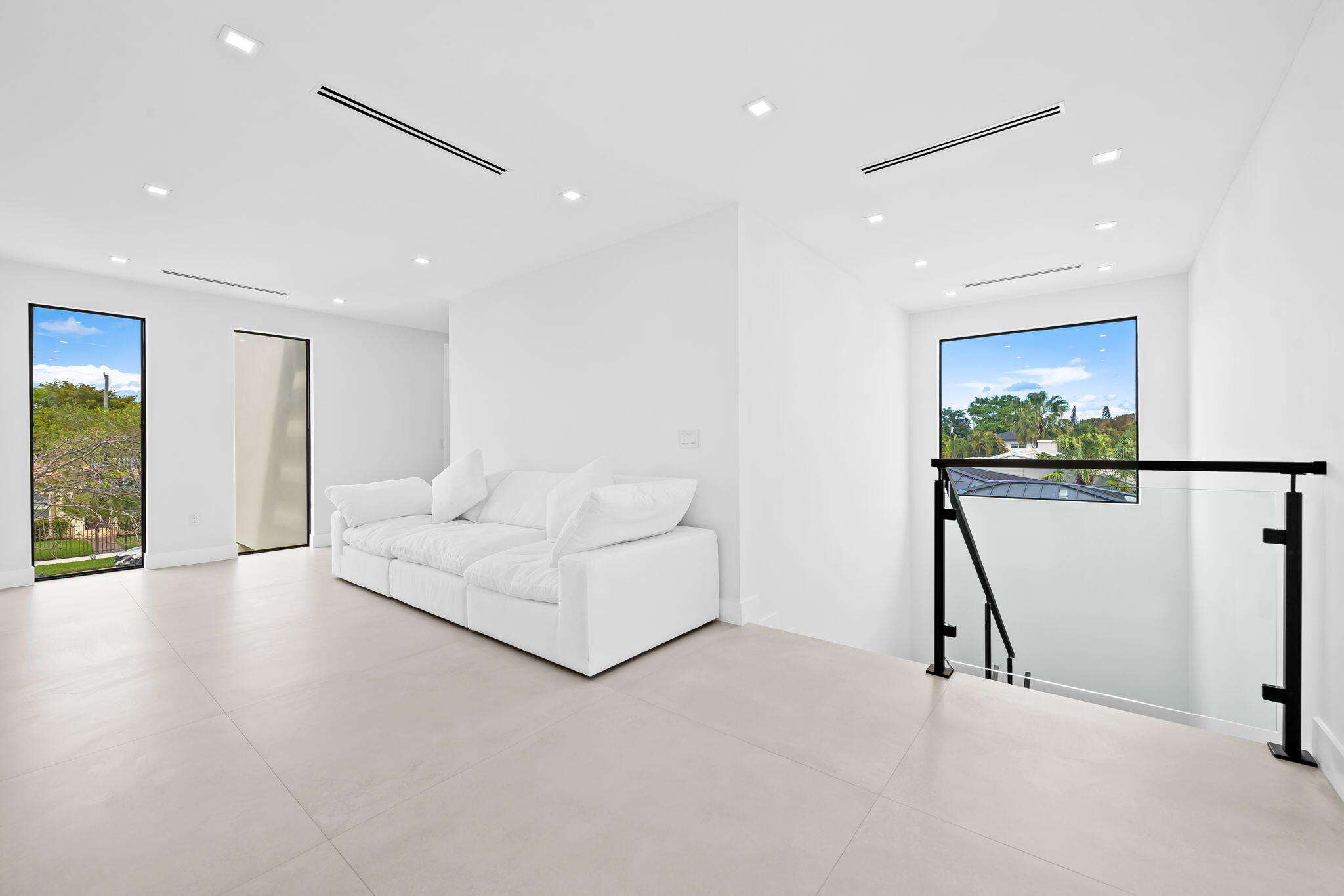 2324 Southwest 26th Street Miami, FL 33133 - Photo 17 of 45 a living room with furniture and a flat screen tv