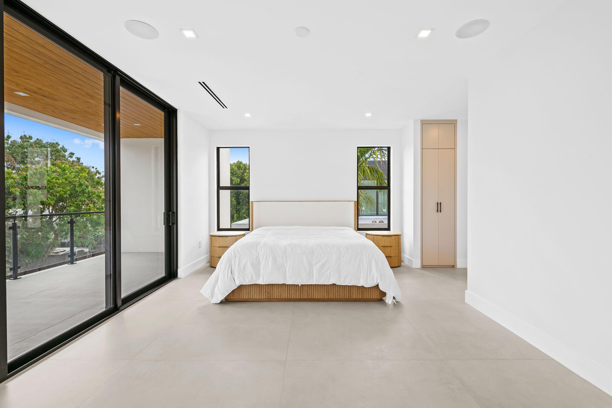 2324 Southwest 26th Street Miami, FL 33133 - Photo 18 of 45 a spacious bedroom with a large bed and a large window