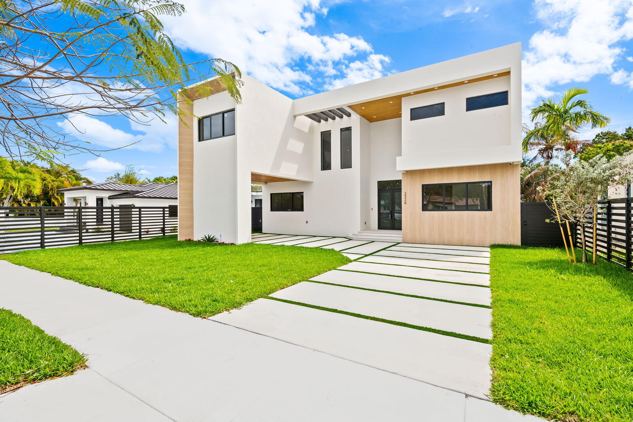 2324 Southwest 26th Street Miami, FL 33133 - Photo 2 of 45 a front view of a house with a yard