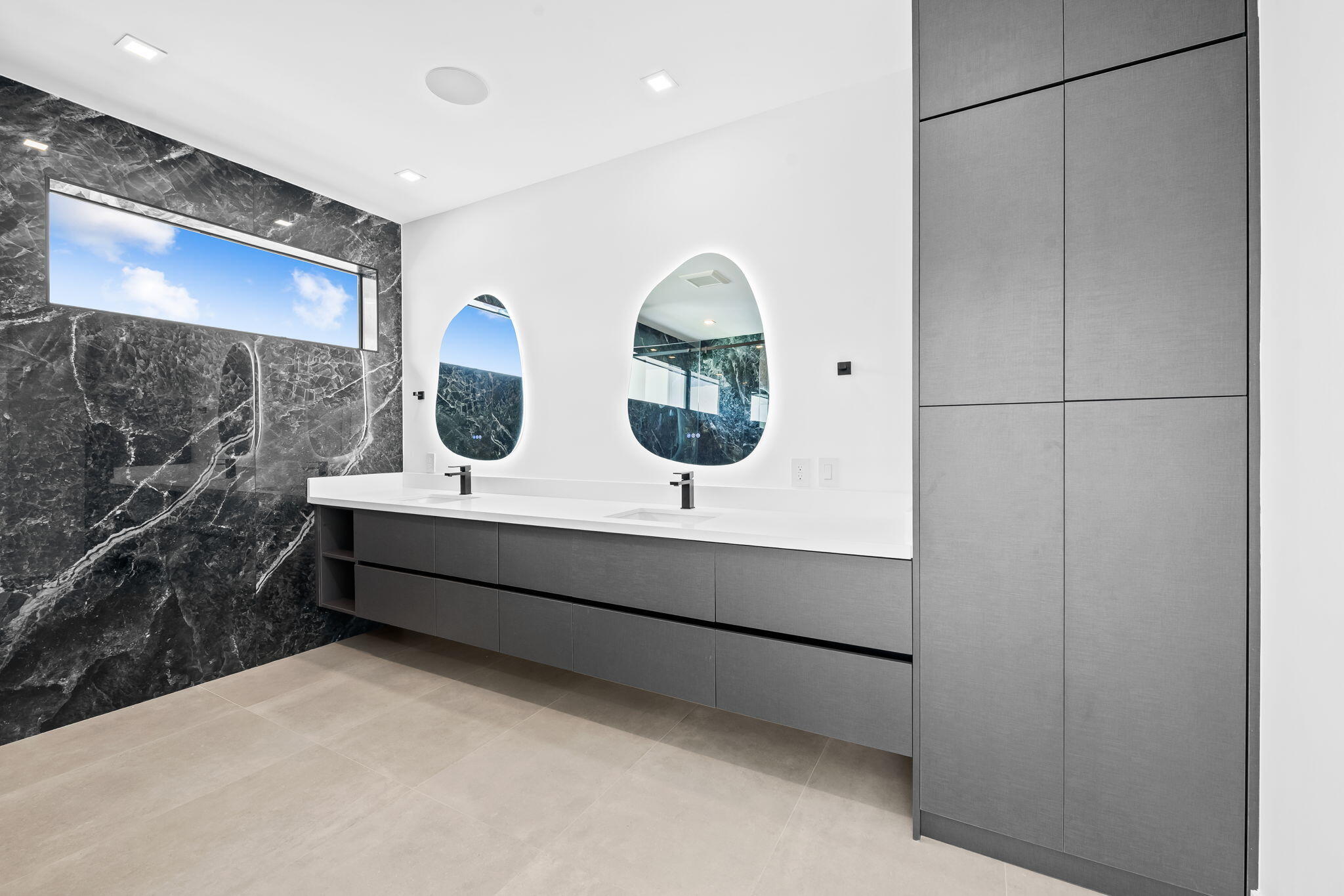 2324 Southwest 26th Street Miami, FL 33133 - Photo 23 of 45 a bathroom with a double vanity sink and a mirror