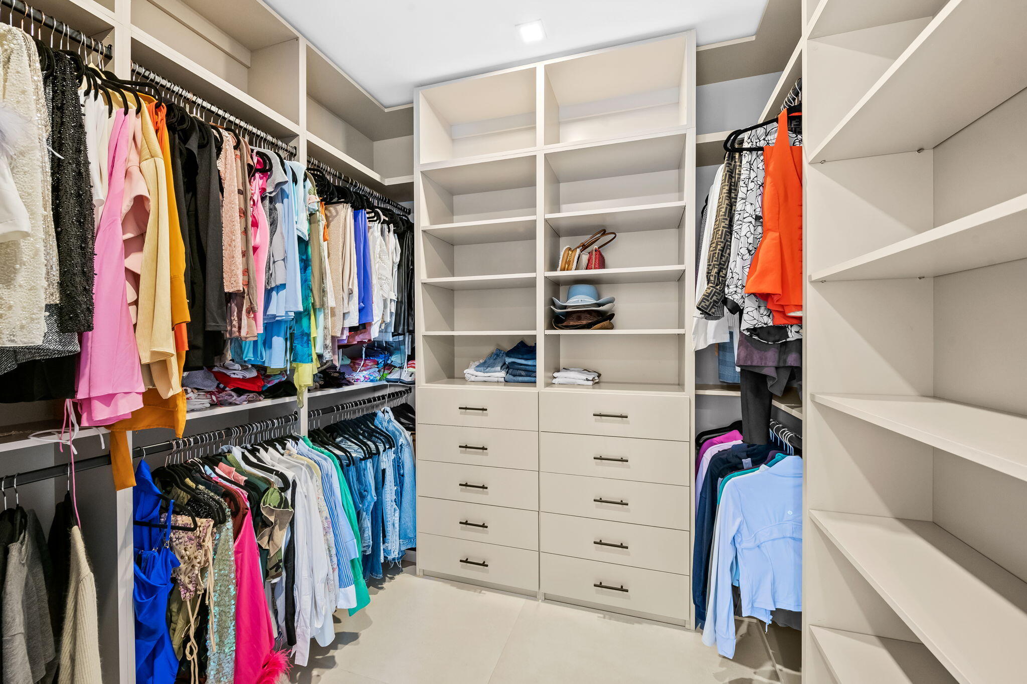 2324 Southwest 26th Street Miami, FL 33133 - Photo 26 of 45 a view of walk in closet with clothes and shoes