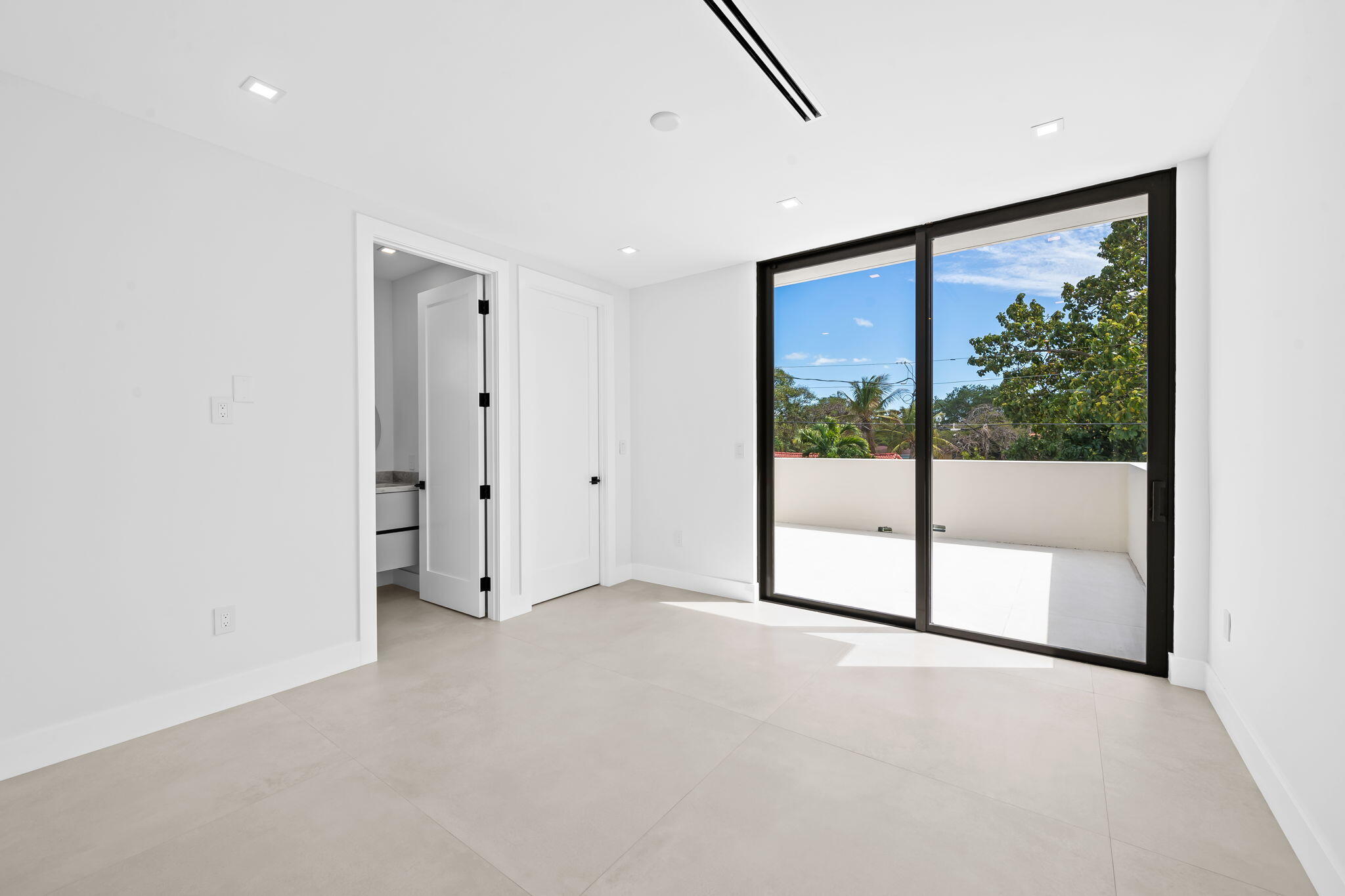 2324 Southwest 26th Street Miami, FL 33133 - Photo 27 of 45 a view of an empty room with sliding glass door