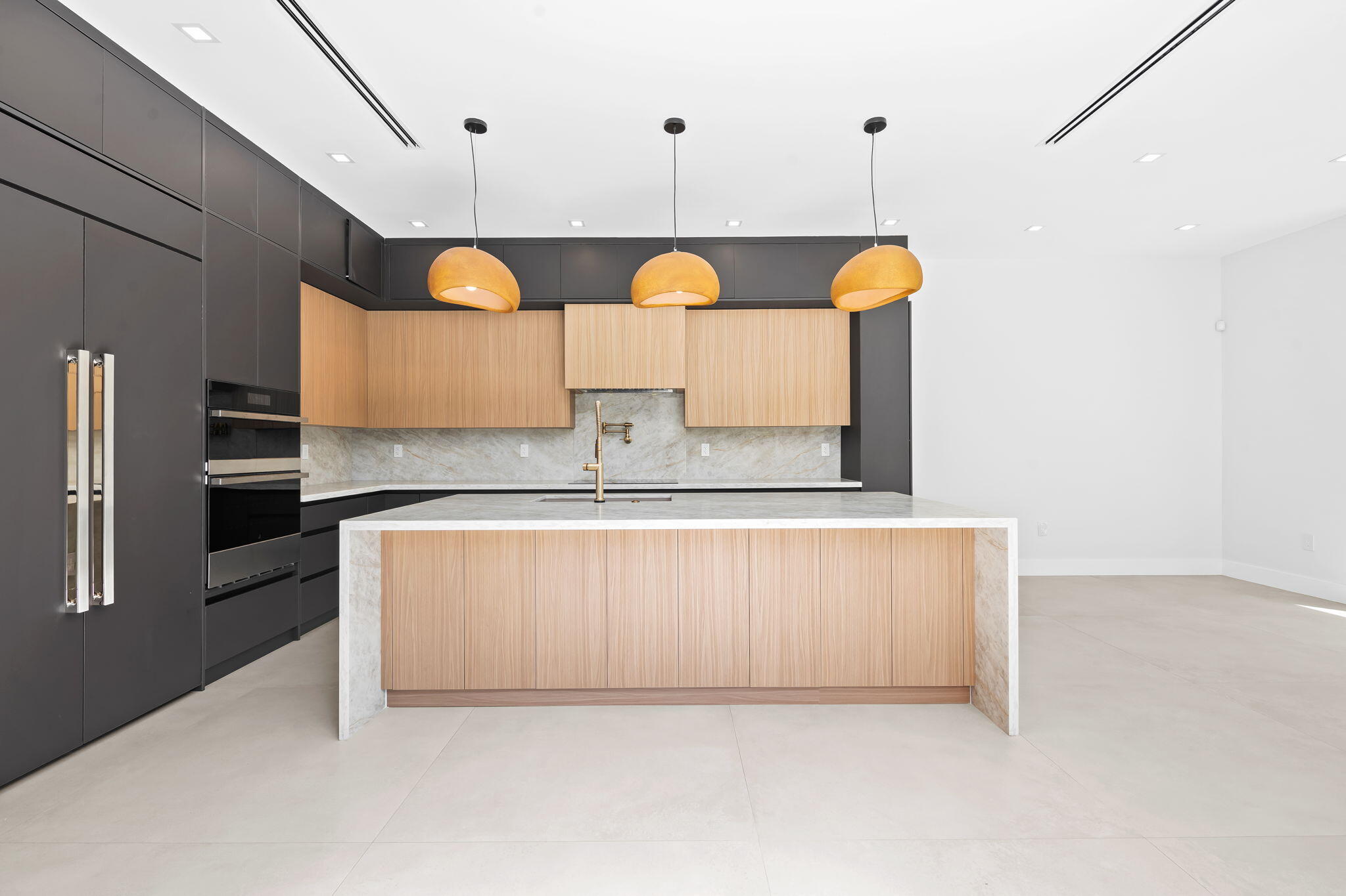 2324 Southwest 26th Street Miami, FL 33133 - Photo 4 of 45 a kitchen with a sink a counter space stainless steel appliances and cabinets