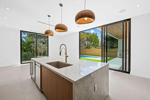 a large kitchen with stainless steel appliances kitchen island a large island in the center