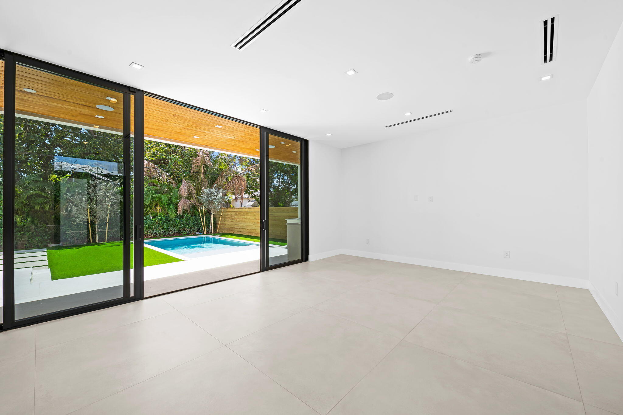 2324 Southwest 26th Street Miami, FL 33133 - Photo 9 of 45 a view of an empty room with glass door