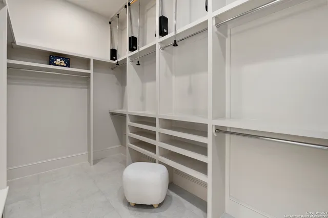 a bedroom with a bed and a night stand