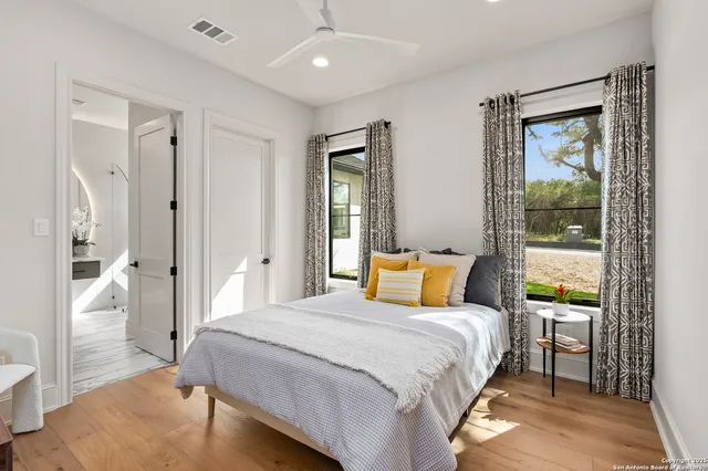 a bathroom with a sink double vanity and a mirror