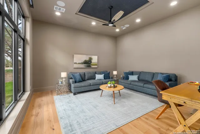 a living room with furniture and a large window