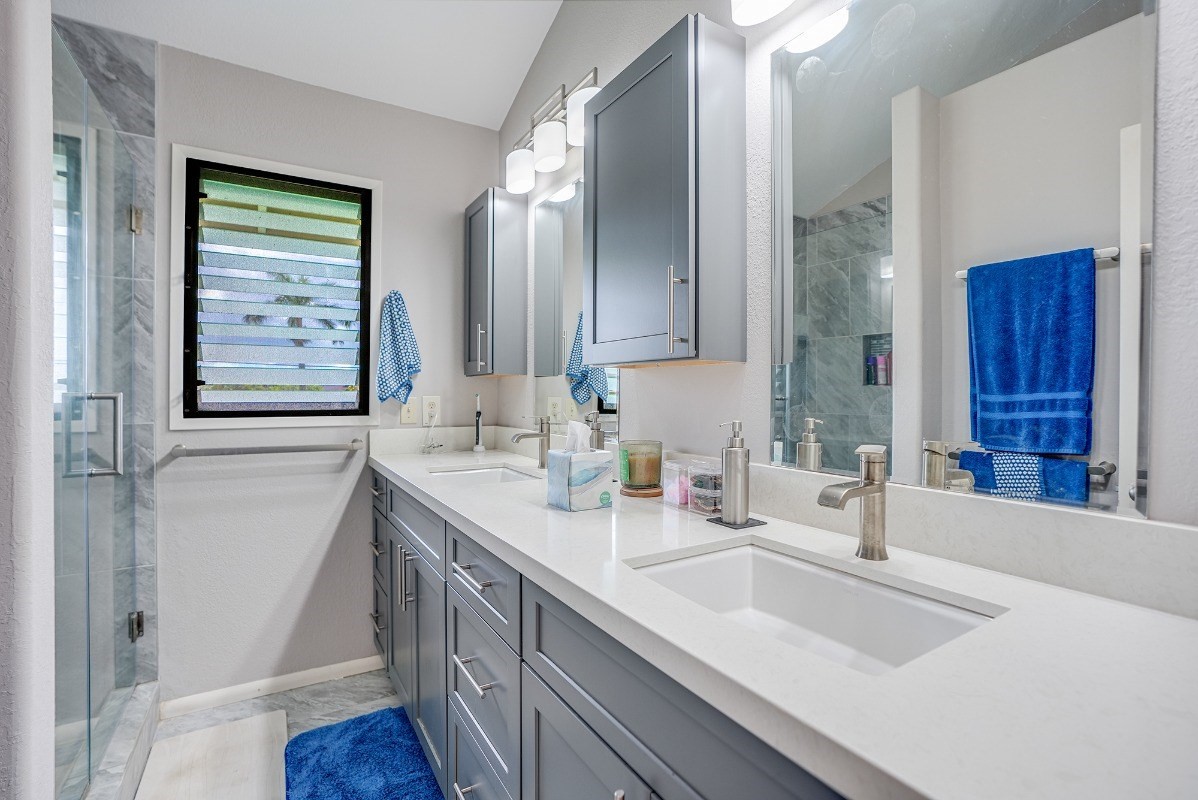 5890 Lokelani Road, Unit 2 Kapaa, HI 96746 - Photo 13 of 29 a bathroom with a sink double vanity and a mirror