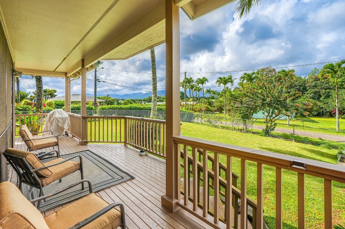 5890 Lokelani Road, Unit 2 Kapaa, HI 96746 - Photo 19 of 29 a view of a chairs and table in patio with a garden