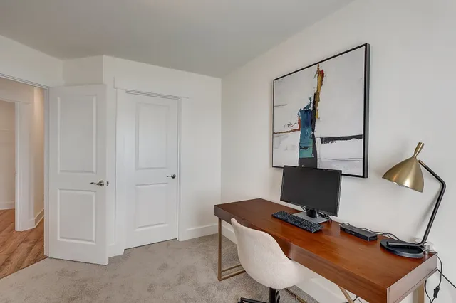 a view of a workspace with furniture