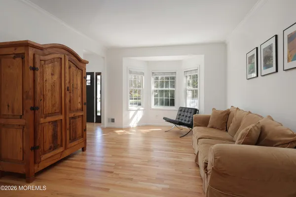 a living room with furniture and windows