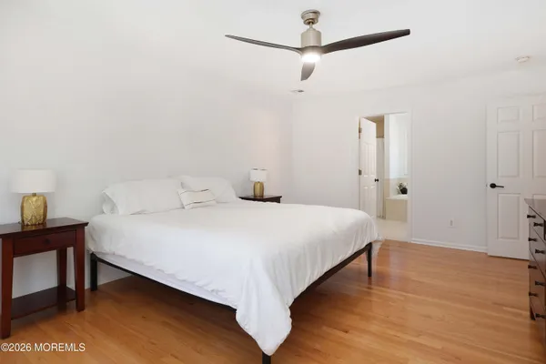 a bedroom with a bed and a table in it