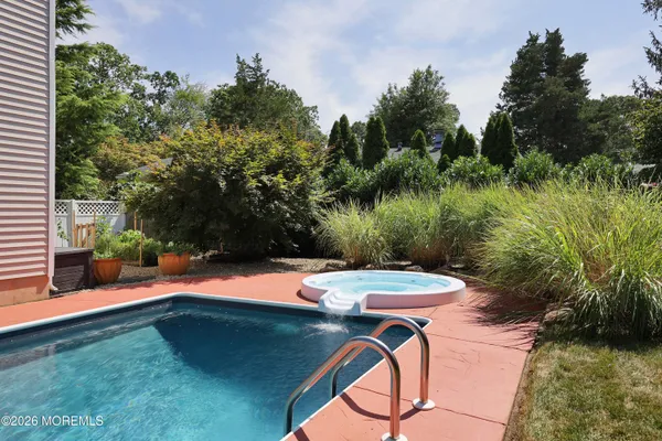 a view of a backyard with sitting area