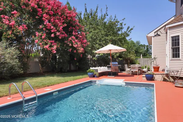 a view of a backyard with sitting area