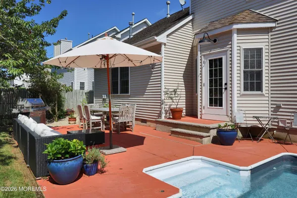 a outdoor space with patio the couches and a potted plant