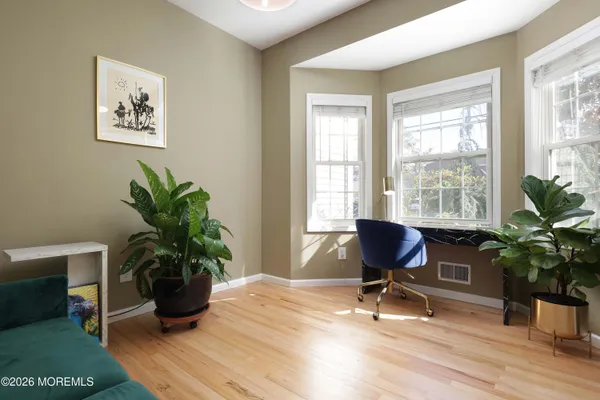 a workspace with furniture and a potted plant