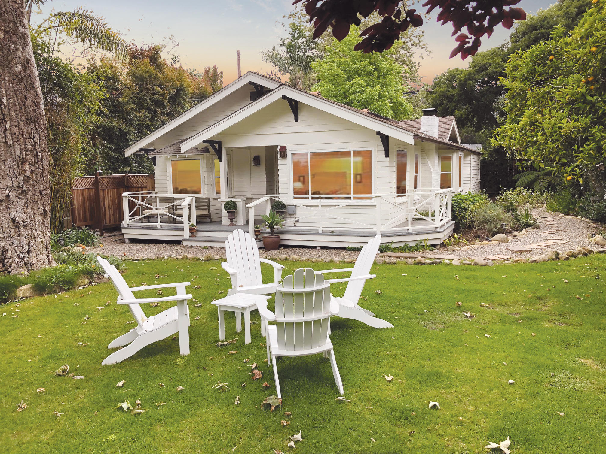a view of a house with backyard sitting area and garden