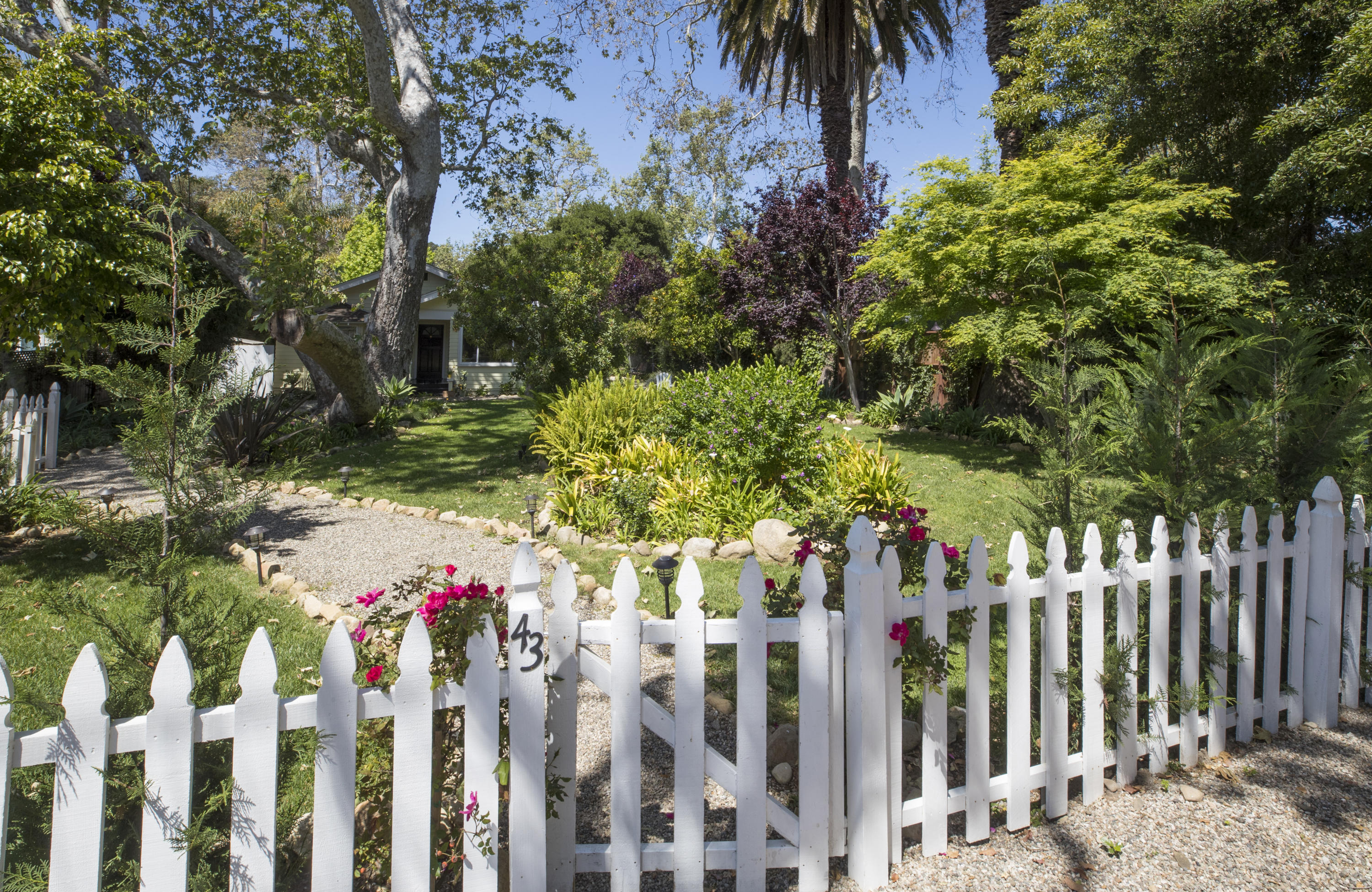 43 Humphrey Road Montecito, CA 93108 - Photo 2 of 17 a front view of a house with a garden