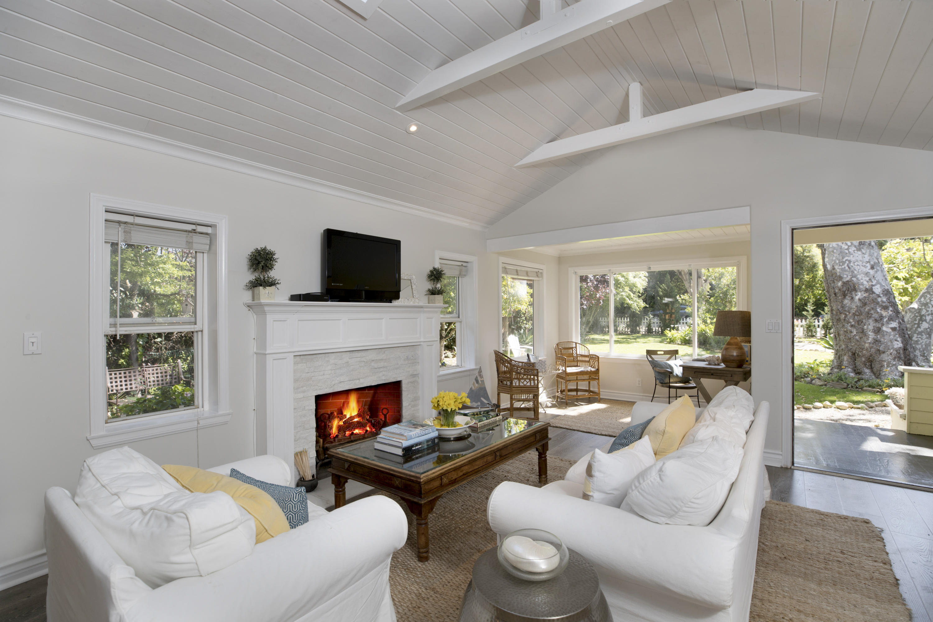 43 Humphrey Road Montecito, CA 93108 - Photo 5 of 17 a living room with furniture fireplace and a large window