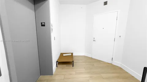 a bathroom with a shower a toilet and a sink