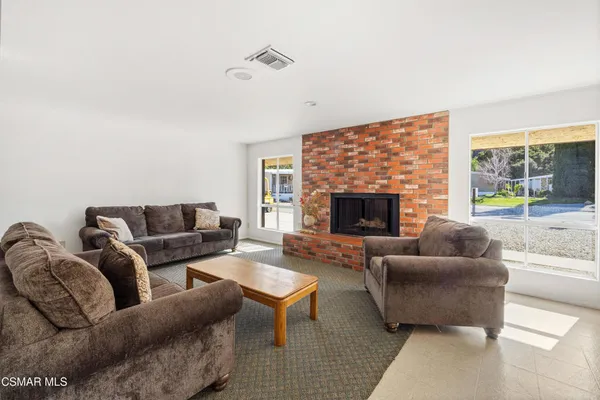 a kitchen with a white cabinets and white appliances