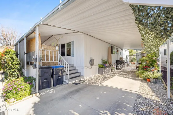 a view of house with patio outdoor seating
