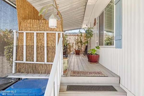a view of a balcony with chair