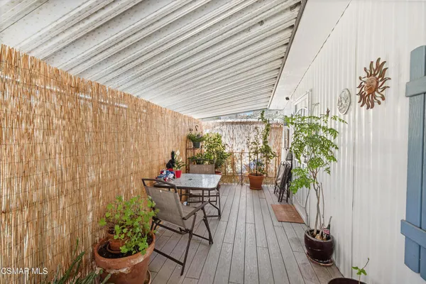 a outdoor dining space with furniture