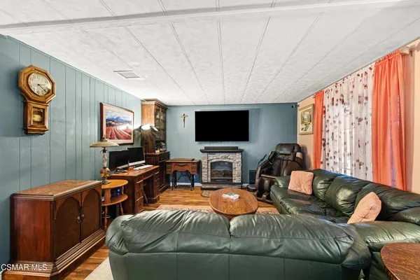 a room with furniture and a flat screen tv