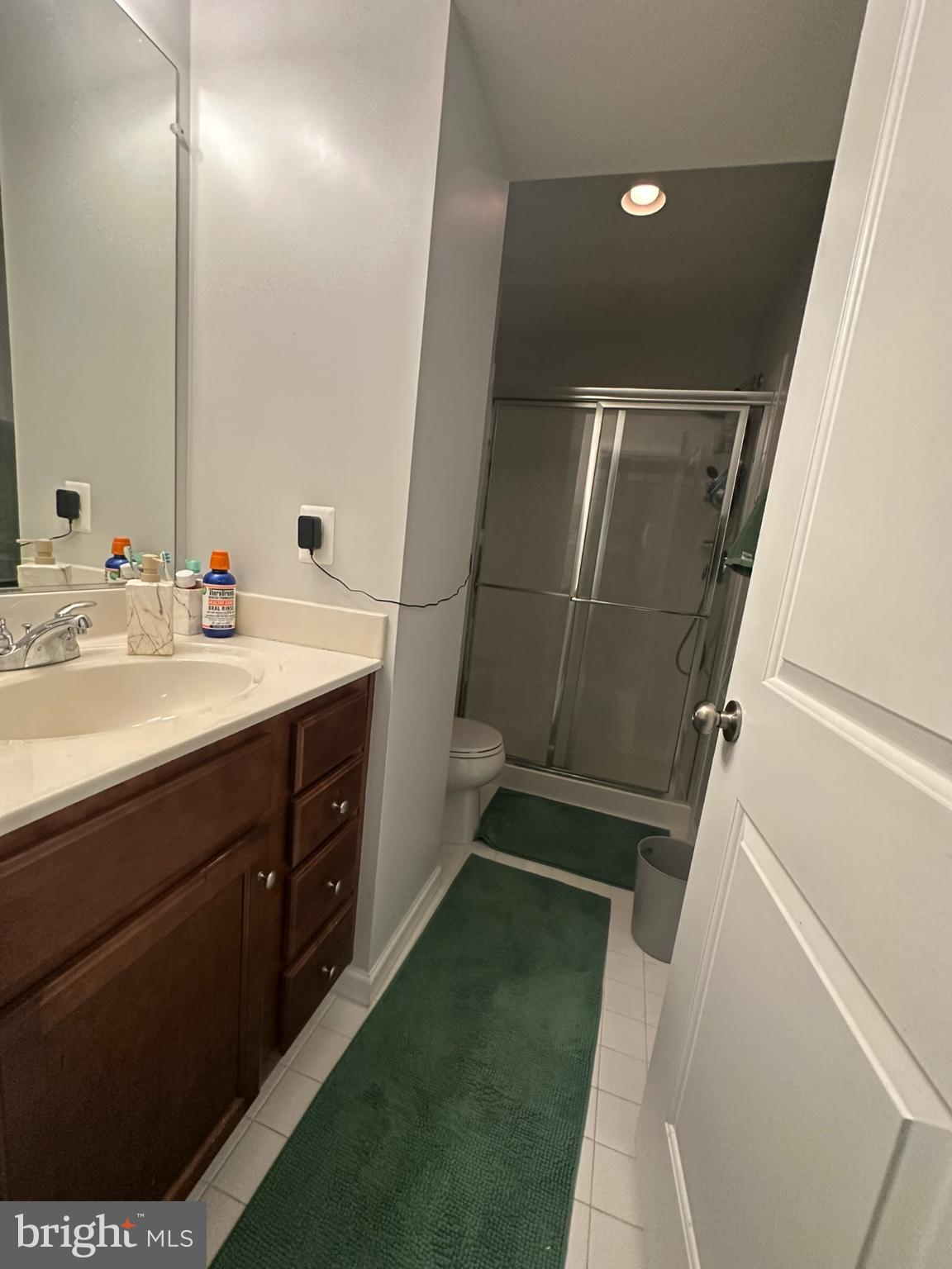 23171 Ambrosia Lane California, MD 20619 - Photo 11 of 18 a bathroom with a sink a toilet and shower