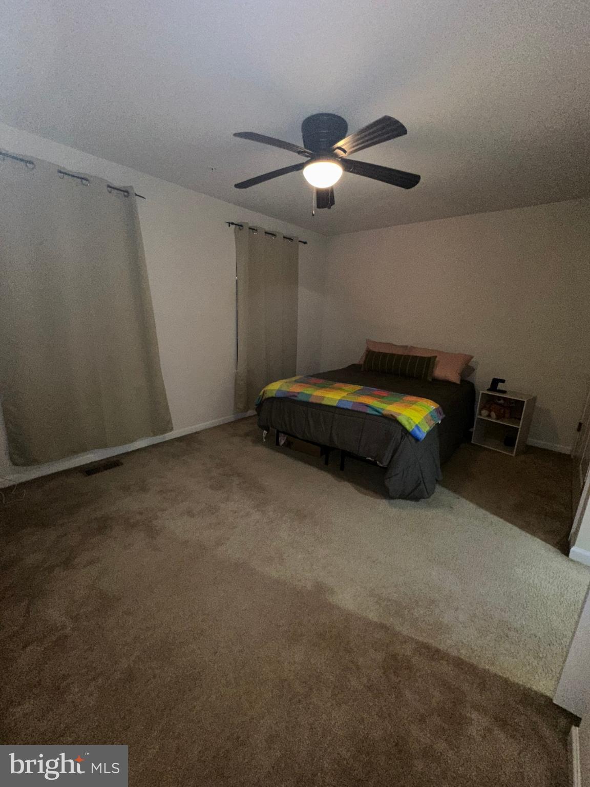 23171 Ambrosia Lane California, MD 20619 - Photo 12 of 18 a living room with furniture and chandelier
