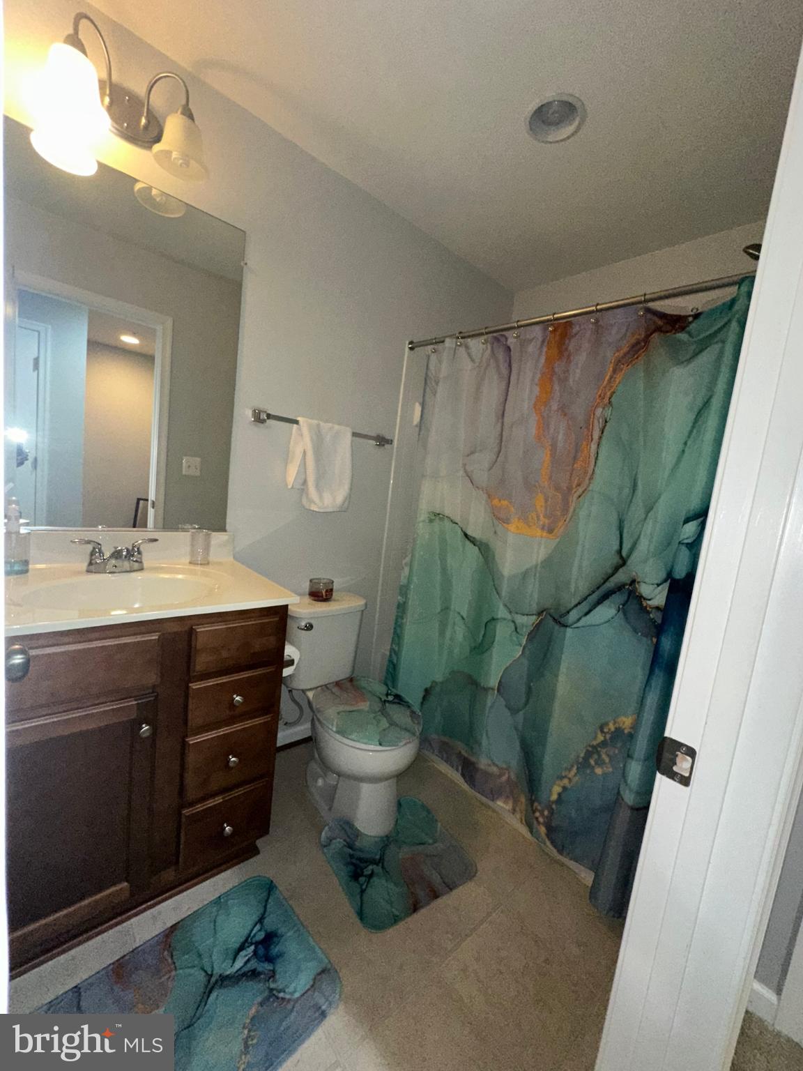 23171 Ambrosia Lane California, MD 20619 - Photo 14 of 18 a bathroom with a sink toilet and shower