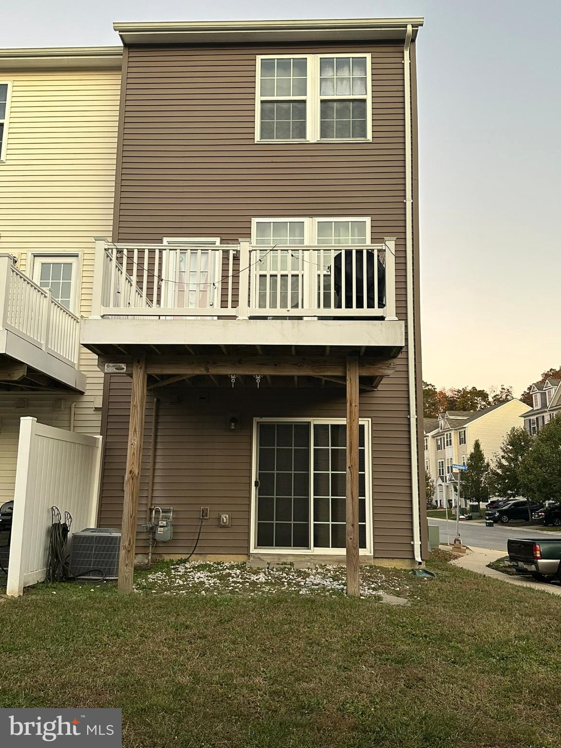 23171 Ambrosia Lane California, MD 20619 - Photo 2 of 18 a front view of a house with a garden