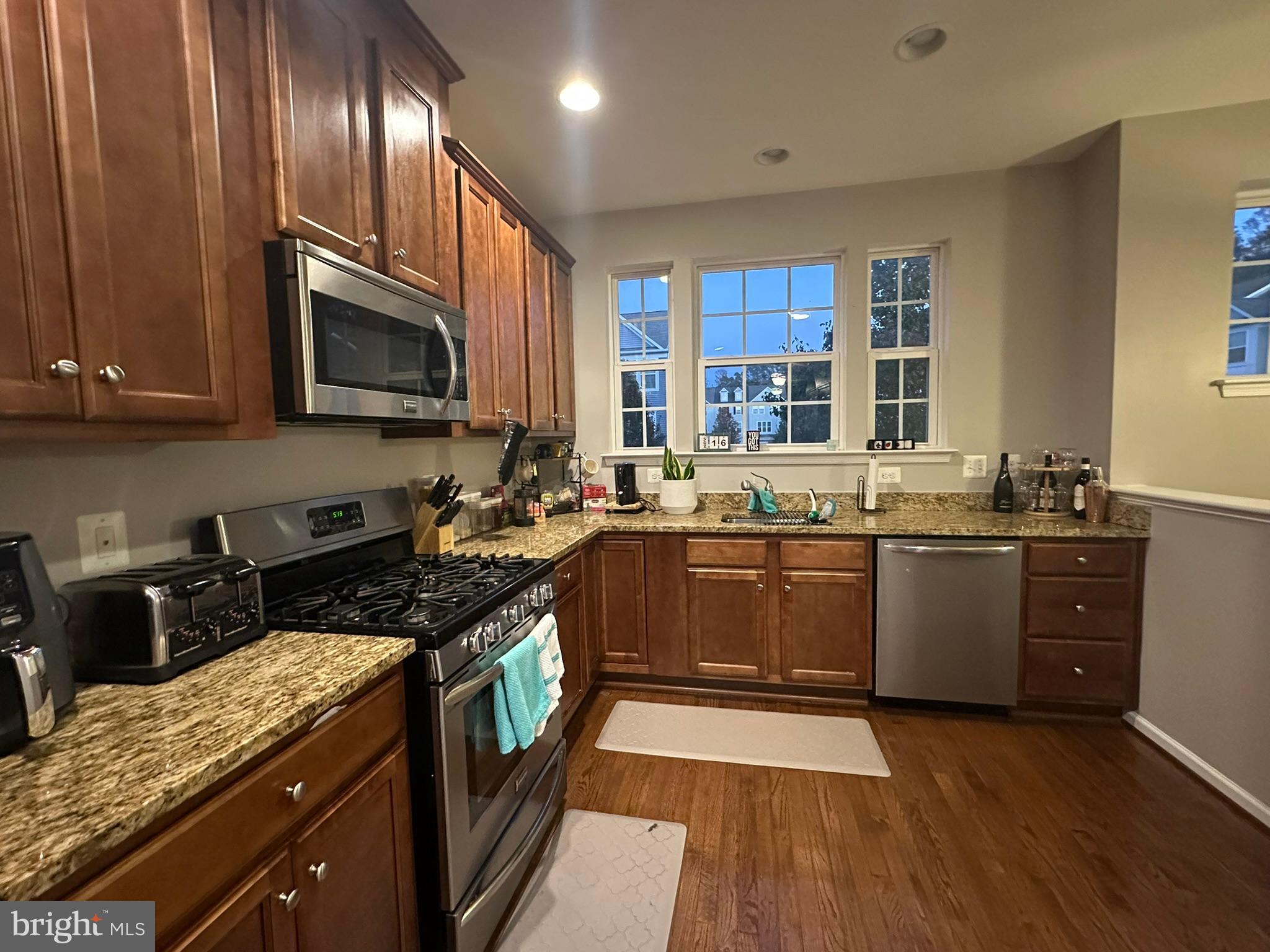23171 Ambrosia Lane California, MD 20619 - Photo 8 of 18 a kitchen with a sink stove top oven and microwave