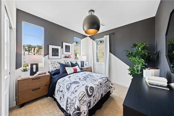 a bedroom with bed and window