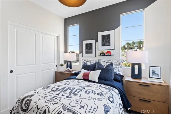 a bedroom with bed and window