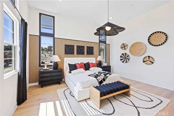 a living room with furniture and view of kitchen