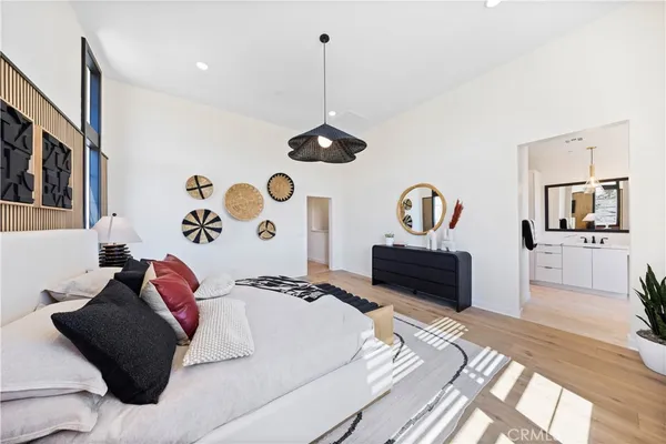 a bedroom with a bed and a dresser