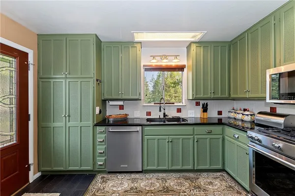 a bed room with a bed and a chandelier