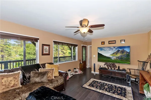a bedroom with two beds and a chandelier