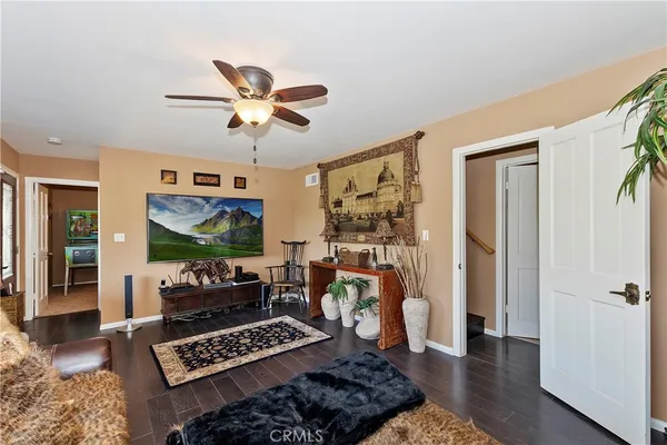 a bathroom with a sink a toilet a mirror and shower