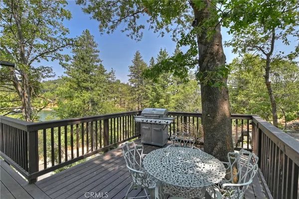 a view of a backyard with sitting area