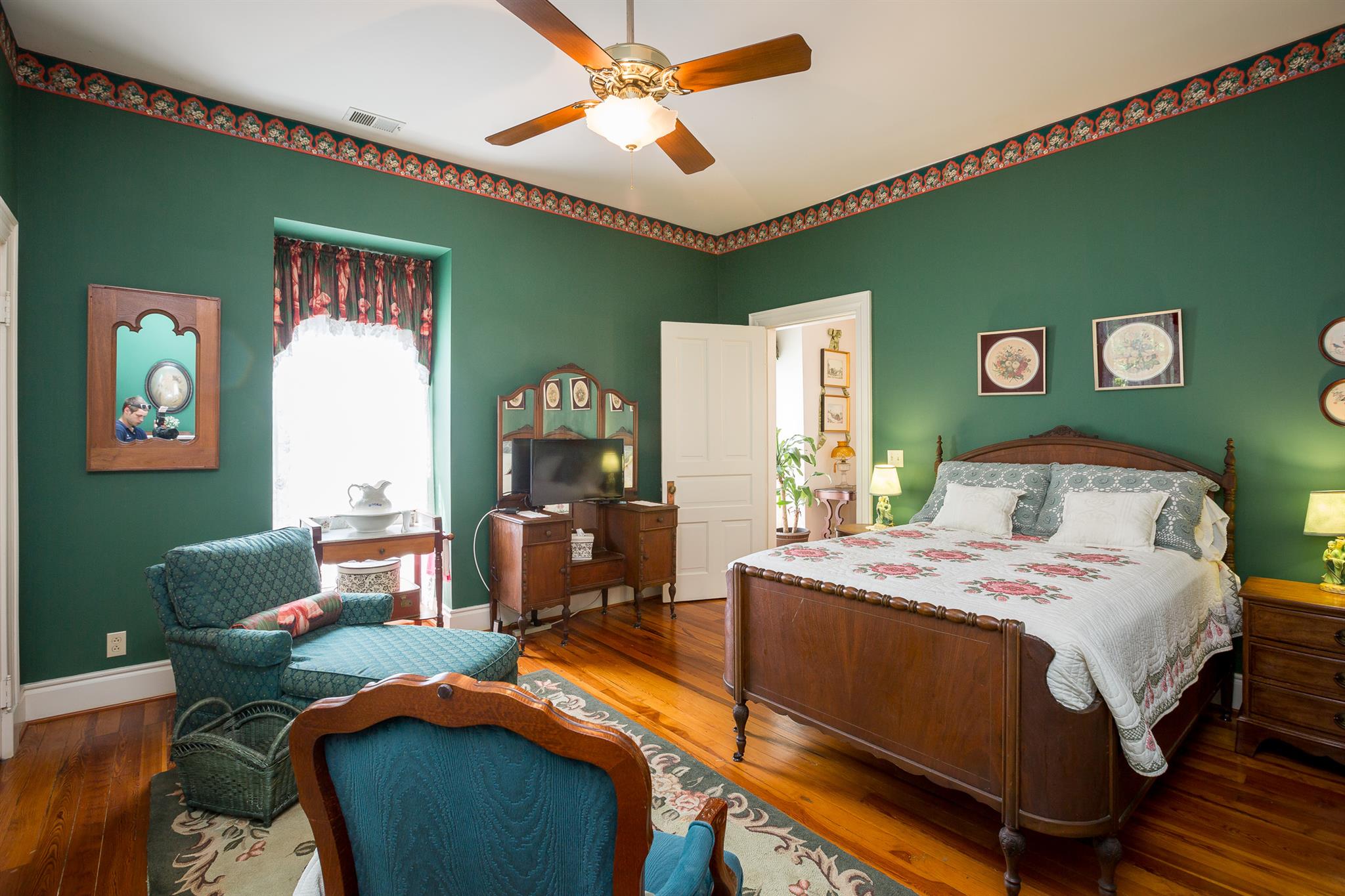 317 North Garner Street Springfield, TN 37172 - Photo 25 of 30 a bedroom with a bed and a chandelier