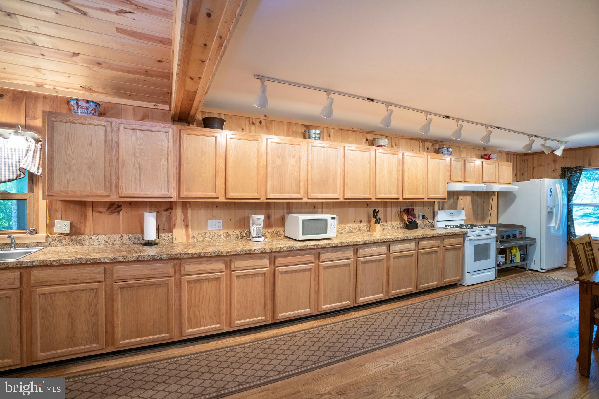 385 Elk Creek Road Aaronsburg, PA 16820 - Photo 24 of 71 a kitchen with a sink cabinets and window