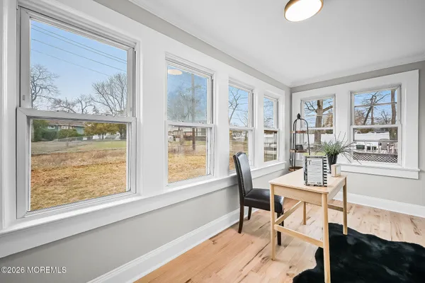 a workspace with furniture and a window