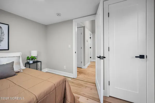 a bedroom with a bed and a table