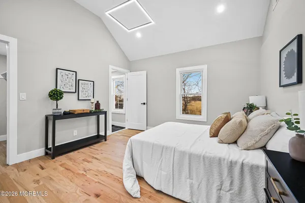 a bedroom with a bed and a dresser