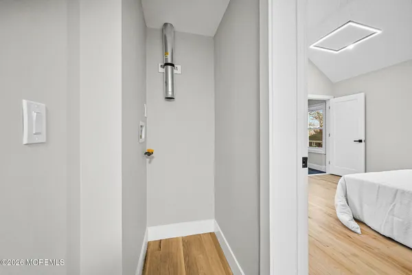 a view of bedroom with wooden floor